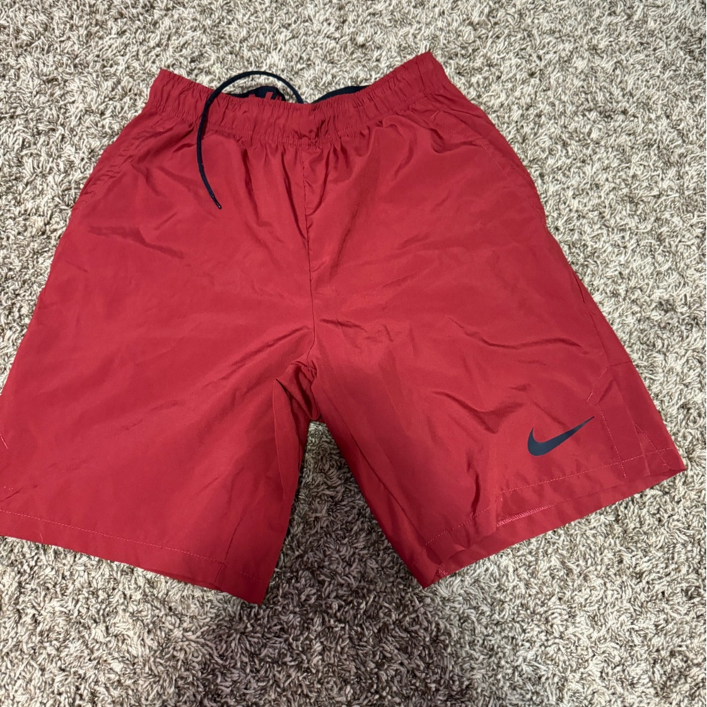 Red Nike shorts
